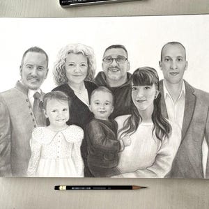 May include: A pencil drawing of a family of seven, including adults and children. The artwork is in grayscale, with detailed shading and realistic facial features. The drawing is on white paper, with a pencil and pen visible.