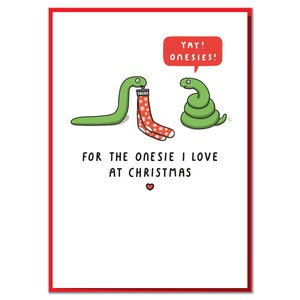 May include: A Christmas card featuring a green snake wearing a red and white stocking with the text "Yay! Onesies!" and the text "For the onesie I love at Christmas".