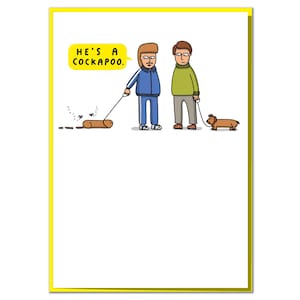 May include: Greeting card with a yellow border. A cartoon shows two men, one with a dachshund, the other with a sausage-shaped dog. A yellow speech bubble says, "HE'S A COCKAPOO." The illustration is humorous and light-hearted.