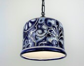 Mexican Talavera flower pots transformed into beautiful colorful pendant light fixtures.