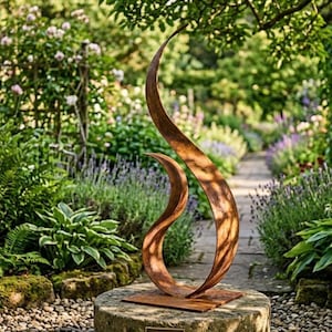 May include: A tall, abstract metal sculpture with a curved, flame-like design. The sculpture is made of weathered, rust-colored metal and stands on a stone base. The background features a lush garden with a stone pathway.