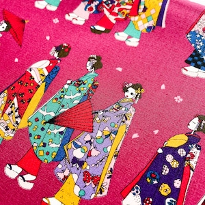 May include: Pink fabric with a repeating pattern of women in traditional Japanese clothing. The women are wearing colourful kimonos with floral and geometric designs. The fabric is perfect for quilting, sewing, and crafting.