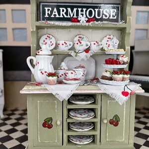 Farmhouse Cherry Theme Hutch, dishes, Christmas tray of goodies, candy canes, sign, silverware, and snowflakes! So Festive!!!!
