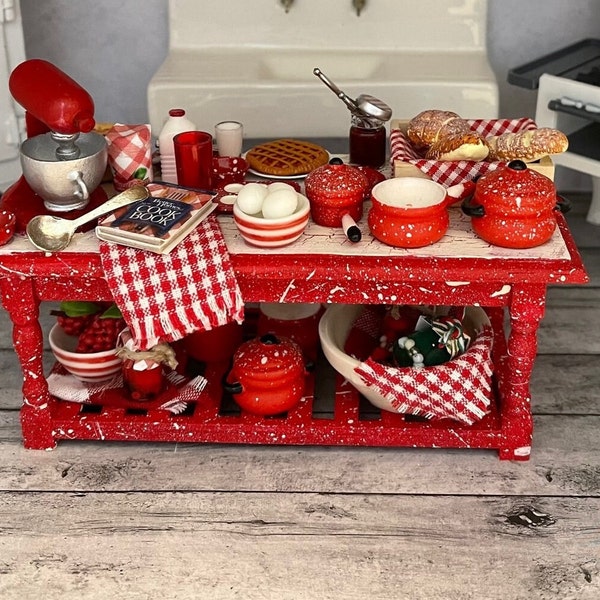 Red Splatter ware style Prep Table Loaded with Red and white themed goodies, mixer, pies, pots, bowls, jars of fake food, B C Cookbook more!