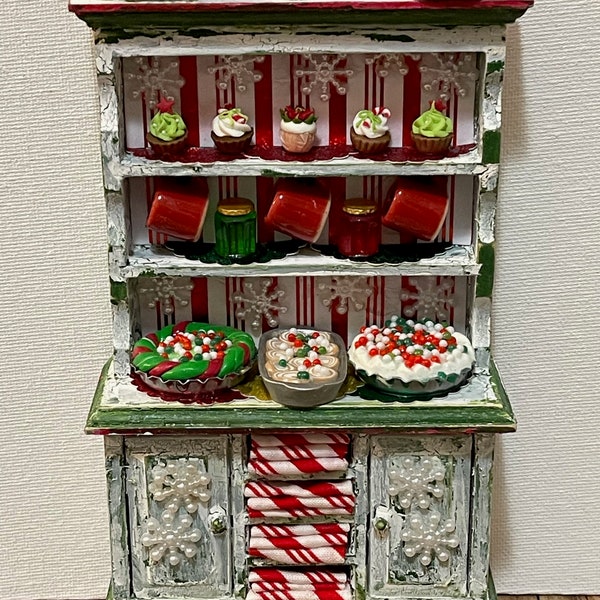 Festive rustic style hutch done in Christmas Farmhouse style w/lots of bakery goodies, perfect for a bakery or Mrs. Santas kitchen too!