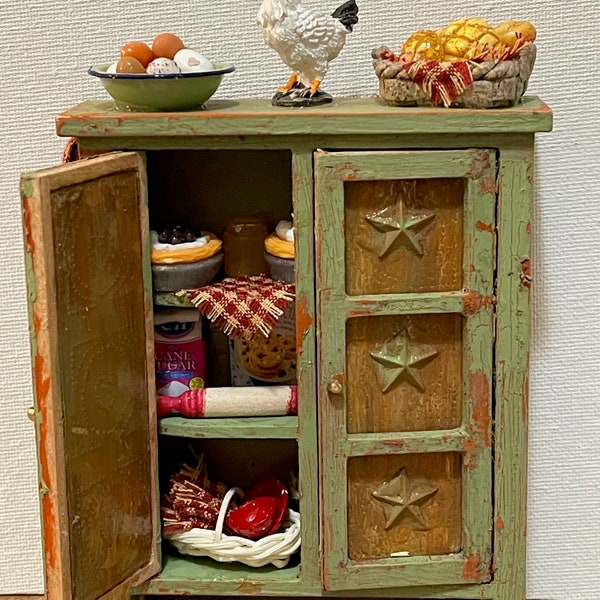 Very rustic Farmhouse Pie Safe w/rusty looking faux tin doors w/added stars filled wth many various kitchen items, even some pies!