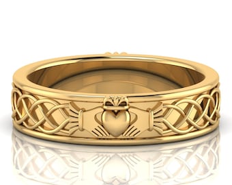 May include: A gold wedding band with a Celtic knot design and a Claddagh symbol in the center. The Claddagh features two hands holding a heart with a crown on top.