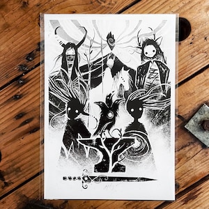 May include: Monochrome art print depicting figures with antlers and cloaks, a raven, and a sword. The artwork has a dark, mystical theme, with intricate details and a minimalist style. The print is presented in a clear sleeve.