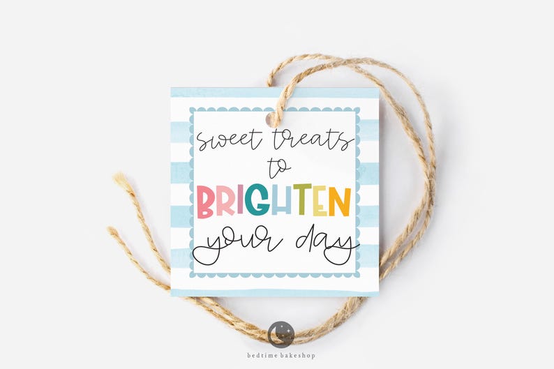 May include: A blue and white striped gift tag with the text "sweet treats to brighten your day" in colorful letters. The tag is tied with twine.