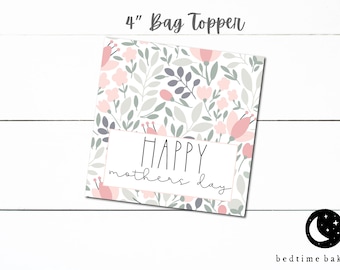 May include: A 4-inch bag topper with a floral pattern in shades of pink and gray. The topper has the text "HAPPY mothers day" in black.