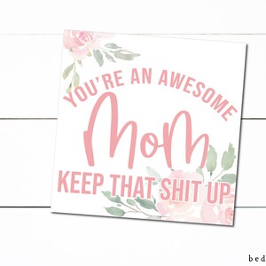 May include: A white card with pink floral designs and the text "You're an awesome Mom Keep that shit up".