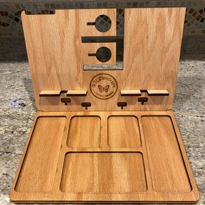 May include: Wooden organizer with multiple compartments for storing small items. The organizer has a phone stand and a butterfly logo that says "@JCSigncraft Custom Creations".