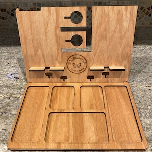 May include: Wooden organiser with multiple compartments for storing small items. The organiser has a phone stand and a butterfly logo that says "@JCSigncraft Custom Creations".