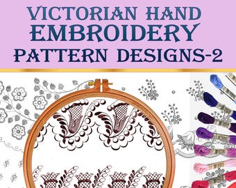 May include: Victorian hand embroidery pattern designs-2. A close-up of a wooden embroidery hoop with a black and white floral design. The hoop is surrounded by other embroidery designs and a variety of colored embroidery floss.