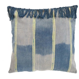 May include: Blue and white striped throw pillow with yellow accents and a fringe border.