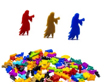 May include: A selection of colourful game pieces, including three figures in red, gold, and blue. The figures are in the shape of cloaked characters. A large pile of assorted game pieces in various colours is at the bottom.