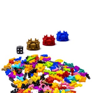 May include: A collection of colourful plastic game pieces, including a black die, and four castle-shaped pieces in red, blue, gold, and brown.