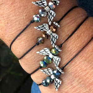 Many color options! Beautiful glass angels adjustable friendship bracelet or anklet strung on tan or black nano cord
