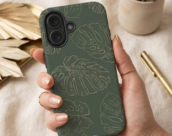 May include: A dark olive green smartphone case featuring a repeating pattern of thin, gold-coloured line art illustrations of monstera leaves. The case has a black camera lens cutout area and a smooth, matte finish covering the back of the device.
