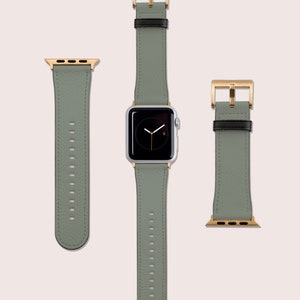 May include: A set of three watch bands in a light green color with gold hardware. The bands are made of leather and have a textured finish. The bands are compatible with Apple Watch.