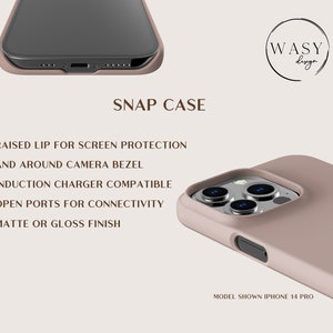 May include: A snap case for an iPhone 14 Pro in a muted rose color. Features include a raised lip for screen protection, camera bezel, induction charger compatibility, and open ports. The case has a matte or gloss finish. The WASY design logo is visible.