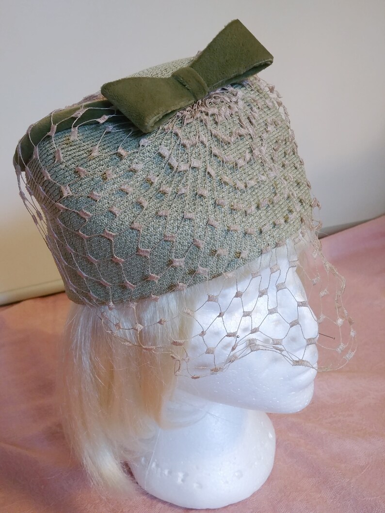 green pillbox hat