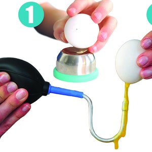 May include: An egg separator tool with a black bulb, blue tube, and a curved metal end. The image shows the process of separating an egg, with a white egg being cracked and the yolk flowing out.