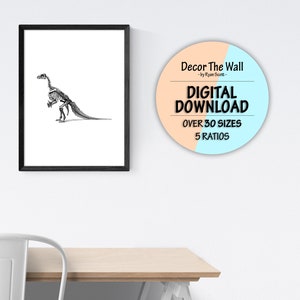 May include: A black and white illustration of a dinosaur skeleton in a black frame. A round sticker with a peach and blue background reads "Decor The Wall - by Ryan Scott - DIGITAL DOWNLOAD OVER 30 SIZES 5 RATIOS"
