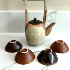 Rare, water well handle Japanese teapot with four tiny teacups in white, blue and maroon glaze. Hand glazed stoneware mini teapot. Signed on the bottom. Estate decor. Tea ceremony sets.
