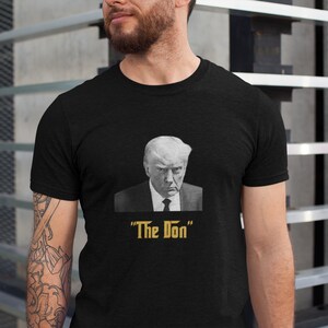 The Don Mugshot Crewneck Softstyle T-Shirt - Donald Trump Parody - Political Satire, Trump Parody Artwork - Political Humor, Trump Supporter