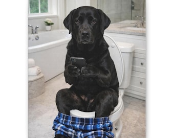 May include: A canvas print featuring a black Labrador Retriever sitting on a toilet, looking at a smartphone. The dog is wearing blue plaid pajama pants. The background shows a bathroom with a bathtub and sink.