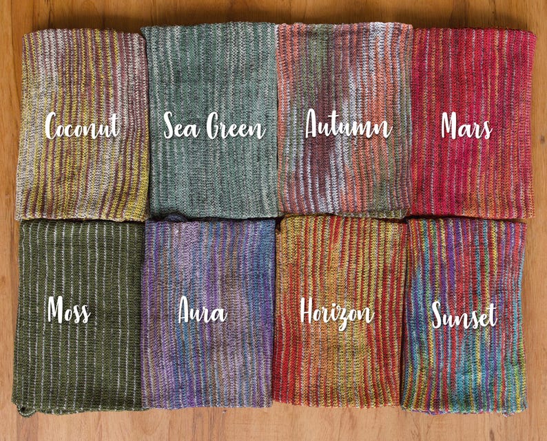 May include: Ten different striped fabric swatches with names written on each. The names are Coconut, Sea Green, Autumn, Mars, Moss, Aura, Horizon, Sunset, and two others that are too blurry to read.