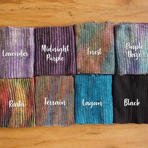 May include: Eight different colored striped fabric swatches with the names "Lavender", "Midnight Purple", "Forest", "Purple Haze", "Rasta", "Terrain", "Lagoon", and "Black" written on them.