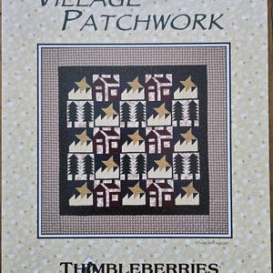 May include: A quilting pattern for a patchwork quilt titled "Village Patchwork" by Lynette Jensen. The pattern features a design of houses, trees, and stars in a black, brown, white, and gold color scheme. The pattern is for a 65-inch square quilt.