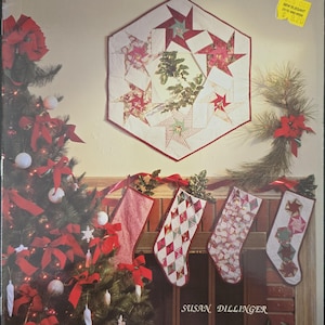 May include: A quilt pattern book titled "Starbound" featuring a red, white, and green star-shaped quilt with a Christmas theme. The book cover also shows a decorated Christmas tree and stockings hanging on a fireplace.