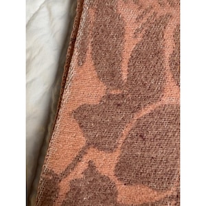 May include: A rustic wooden sign with the text "Welcome to our home" in white lettering. The sign features a distressed finish and a simple, inviting design, perfect for entryway decor.