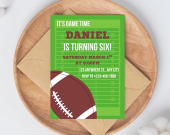 May include: A green football-themed invitation with the text "IT'S GAME TIME" and "DANIEL IS TURNING SIX!" A brown football graphic is on the bottom left. The invitation is on a wooden plate with a brown envelope.
