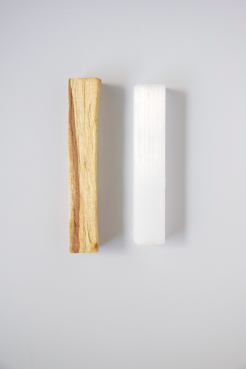 palo_santo_stick, selenite_crystal_wand, energy_cleansing_tools