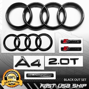 May include: A black out set of car emblems, including the Audi logo, "S line" badges with red accents, "A4" and "2.0T" lettering, and a "Quattro" emblem. The image also includes a "100% Satisfaction Guarantee" badge.