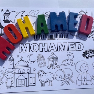 May include: A colouring page with the name "MOHAMED" spelled out in colourful letters. The page features illustrations of a mosque, a crescent moon, a sheep, a drum, and other Islamic symbols. The text "Ramadan Kareem!" and "Good Vibes" are also included.