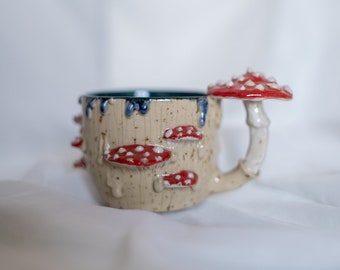 Cottagecore cute red and white mushroom mug with sculpted details of amanita type fungi, forest themed handmade ceramic cup.