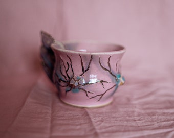 Fairycore magical pastel cup with 3d hand sculpted detailed flowers and silver luster accents. Porcelain cute fairy mug in pink blue green