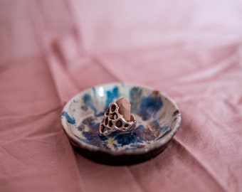 Witchy dark crystal ring holder jewelry dish. Handmade stoneware ceramics with effect blue white glaze and pink crystal for jewelry