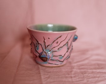 Fairycore magical pastel cup with 3d hand sculpted detailed flowers and silver luster accents. Porcelain cute fairy mug in pink blue green