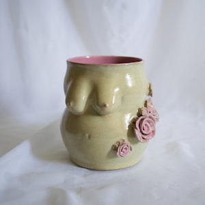 Pink roses boob/tit vase in body shape and curves glazed with shiny mint and pink interior. Detailed flower sculpture attachment
