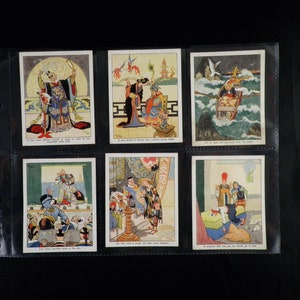 May include: Six vintage cards with colourful illustrations depicting scenes from a Chinese folktale. The cards feature characters in traditional clothing, a boat on a stormy sea, and a scene inside a building. The text on the cards reads: "A fool never admits himself as tough as what he has encountered before", "A man thinks he knows, but a woman knows better", "Let us go, God, but save me from the crabs", "Even visitors gamble most at the play", "He who takes a single step, may bring happiness", "If someone tells you you are drunk, go to bed."