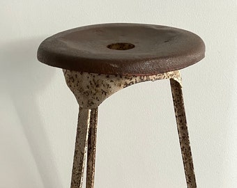 Old industrial tripod stool