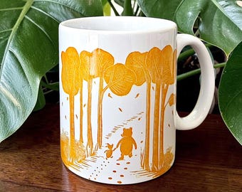 Pooh & Piglet Mug - linocut image of Winnie the Pooh and friend in wood. Wraparound. Friendship and love gift
