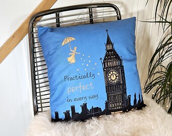 May include: Blue throw pillow with a black silhouette of Big Ben and a woman holding an umbrella. The text "Practically perfect in every way" is printed on the pillow.