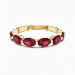 18kk Gold Oval Cut Ruby Half Eternity Band